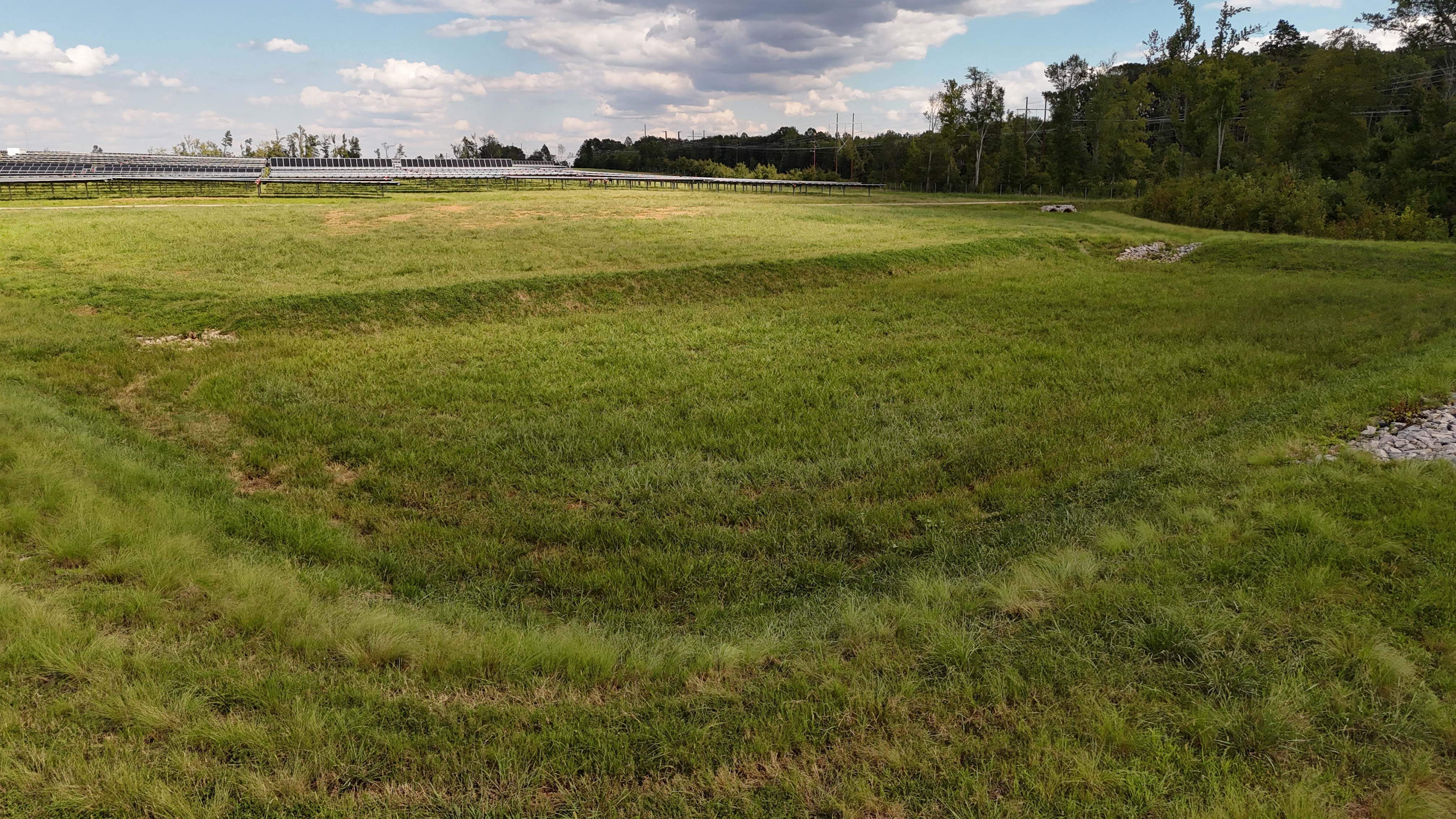 Same site after erosion control installation and grading — stabilized and compliant